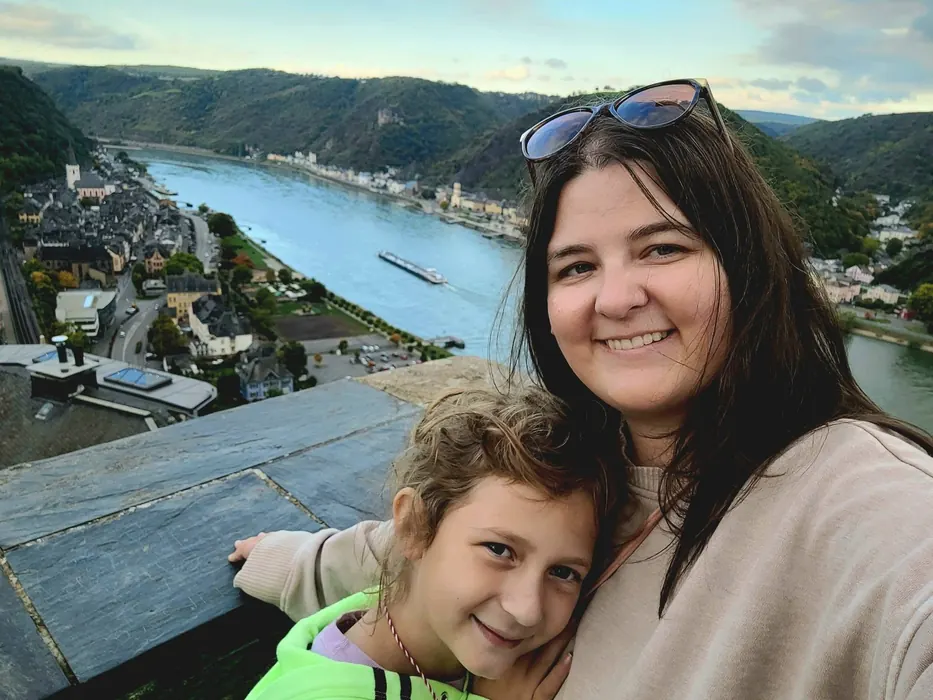 Jordan and her daughter overlooking a river