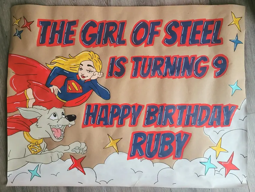 The Girl of Steel Is Turning 9 superhero birthday banner for Ruby