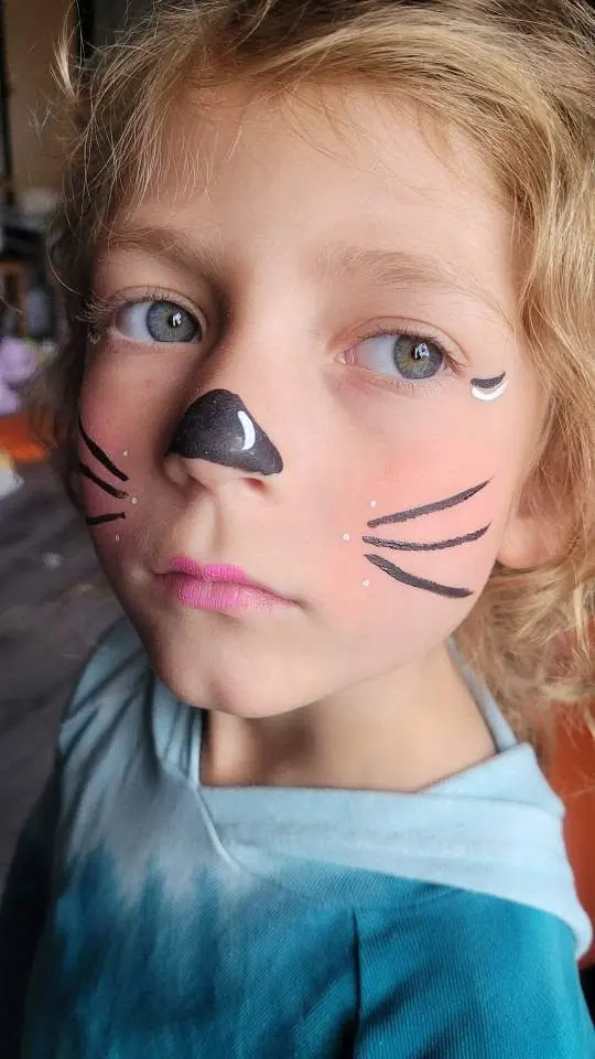 Child with a mouse nose and whiskers