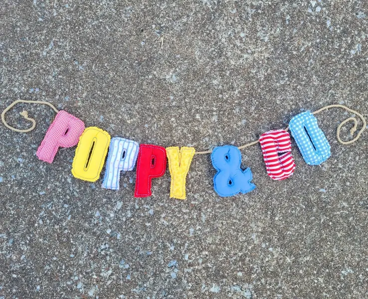 Fabric letter banner spelling Poppy & Bo