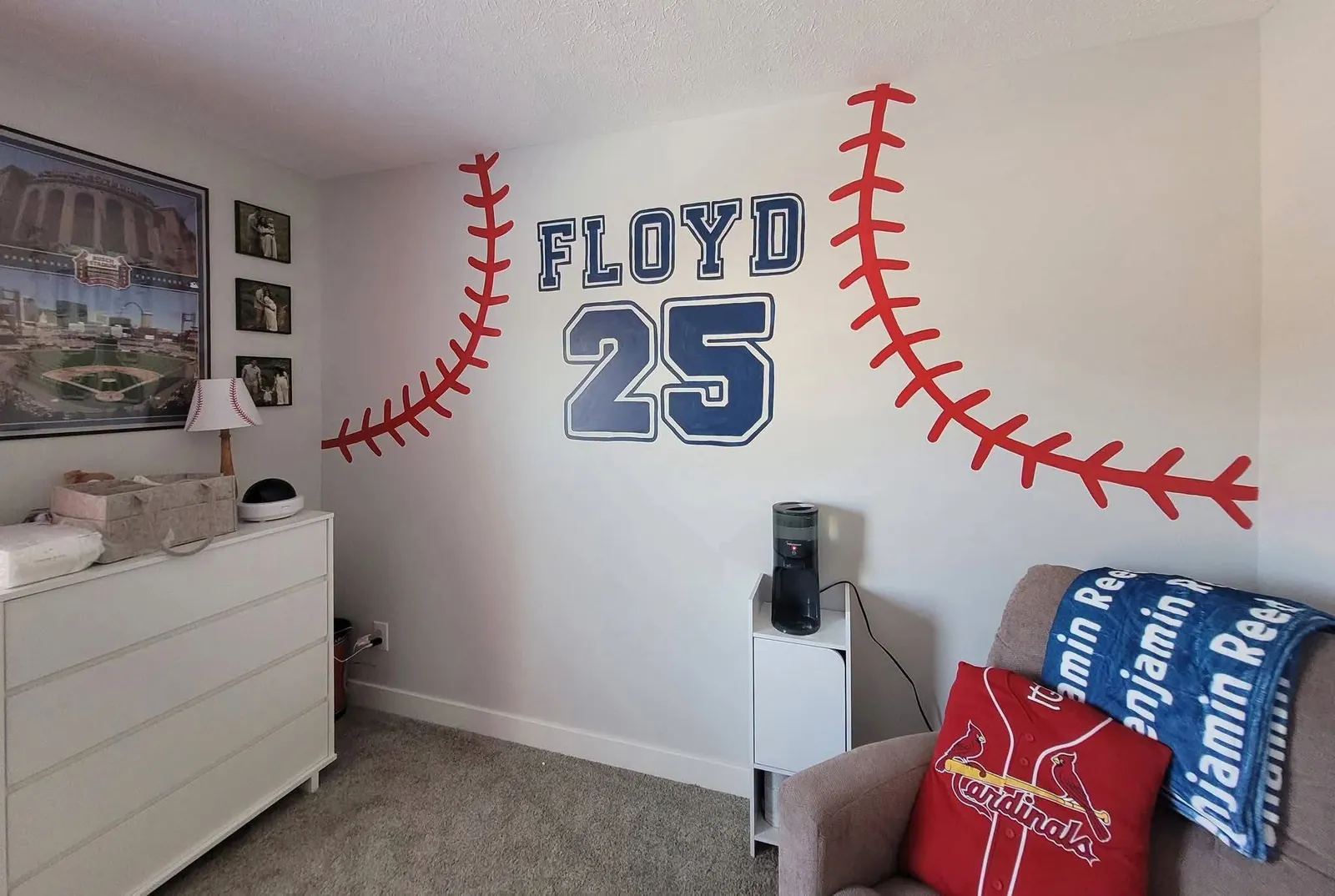 Bedroom wall painted with baseball stitching and Floyd 25