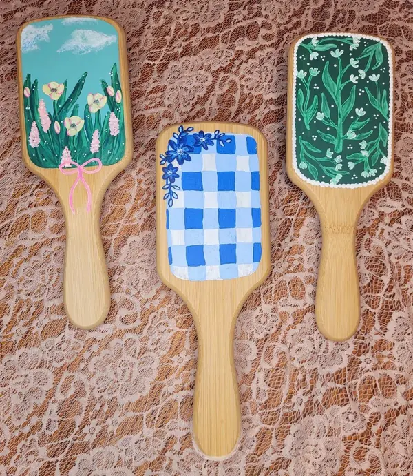 Three hand-painted hairbrushes with florals and blue gingham